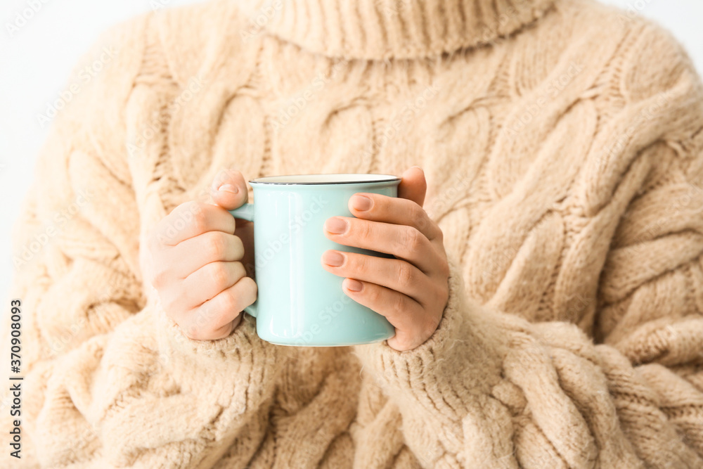 Woman with cup of hot tea at home, closeup Woman with cup of hot tea at home, closeup