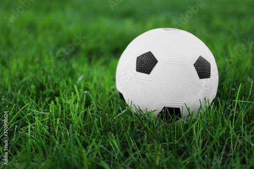 Soccer ball on green grass outdoors