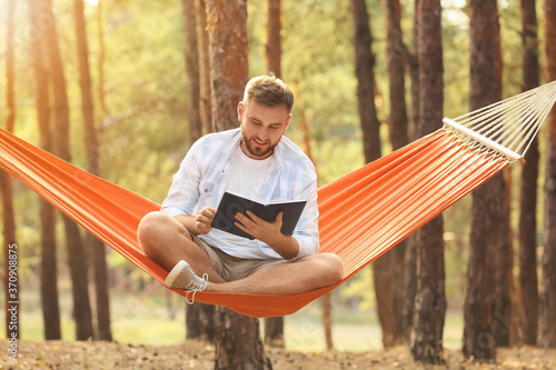 Young man with book relaxin...