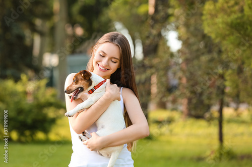 Young woman with cute dog w...
