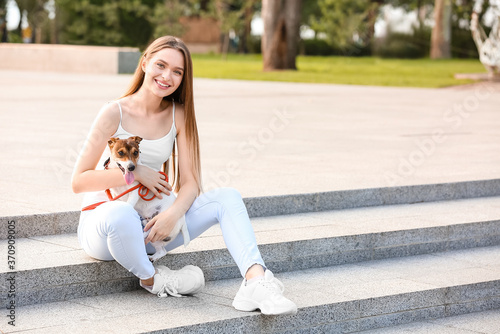 Young woman with cute dog w...
