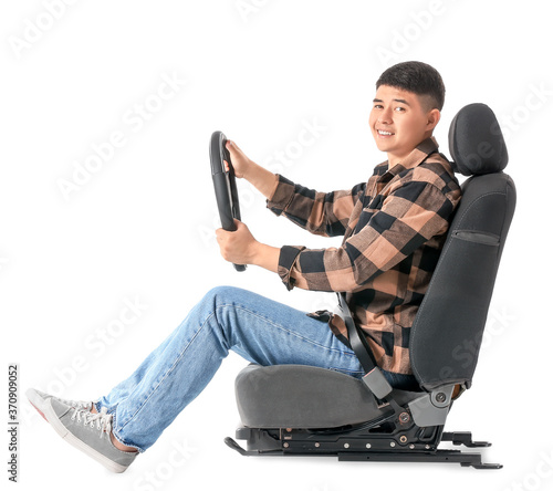 Asian man with steering whe...