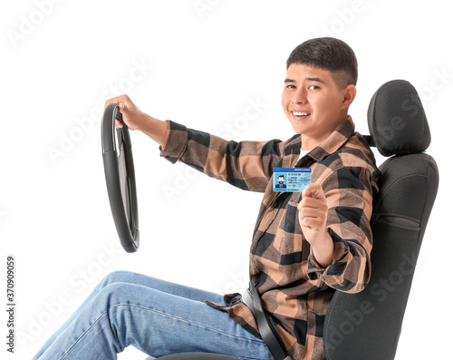 Asian man with steering whe...