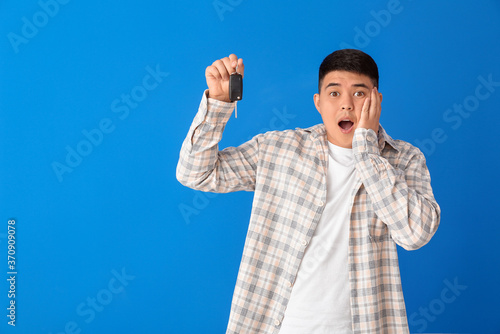 Surprised Asian man with ca...