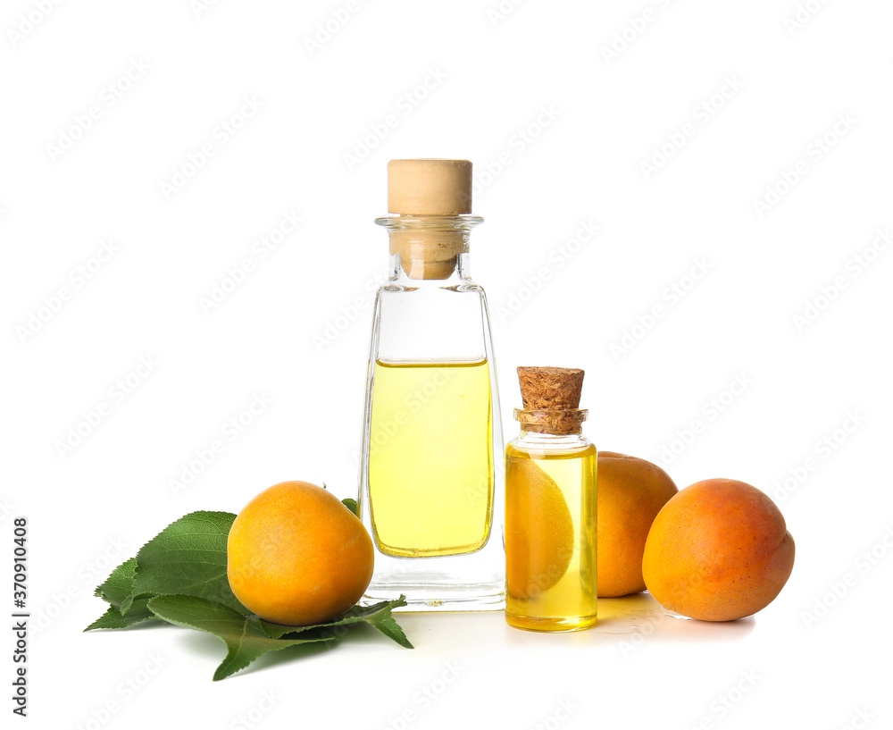 Bottles of apricot essential oil on white background Bottles of apricot essential oil on white background