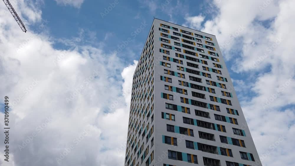 New modern colorful high-rise building in a modern residential complex New modern colorful high-rise building in a modern residential complex
