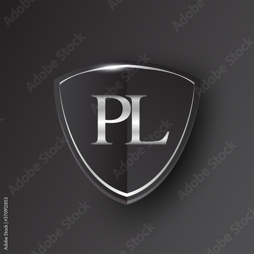 Initial logo letter PL with shield Icon silver color isolated on black background, logotype design for company identity.