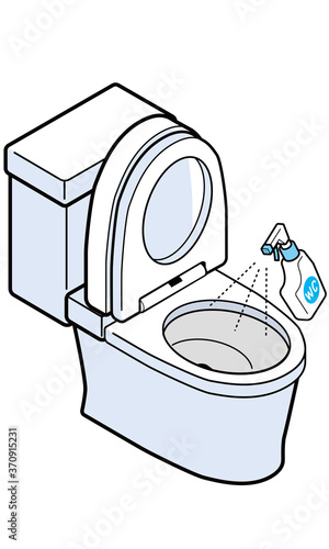 洋式トイレの便器に洗剤をスプレーしている