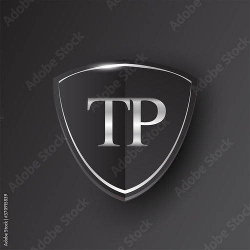 Initial logo letter TP with shield Icon silver color isolated on black background, logotype design for company identity.