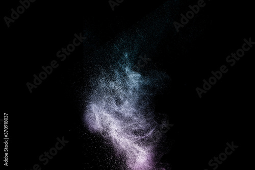  purple and deep blue powder explosion with black space