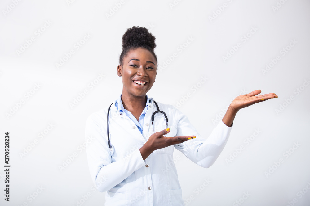 Doctor black woman, medical professional pointing in right direction isolated over white background. Female mature doctor with stethoscope Doctor black woman, medical professional pointing in right direction isolated over white background. Female mature doctor with stethoscope