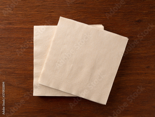 Tableau sur toile Paper napkins on a wooden background