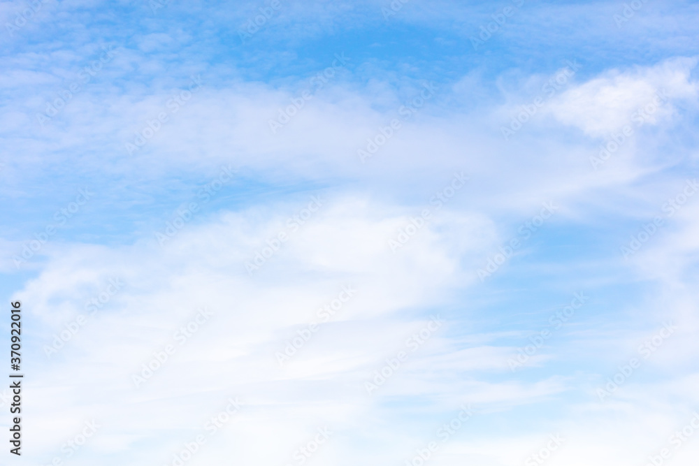 White clouds on a blue sky as background White clouds on a blue sky as background