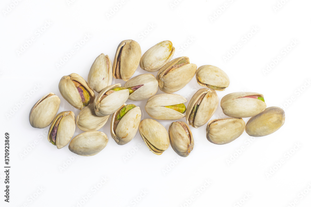 Pistachio, neatly laid out, beautiful work on a white background. Pistachio, neatly laid out, beautiful work on a white background.