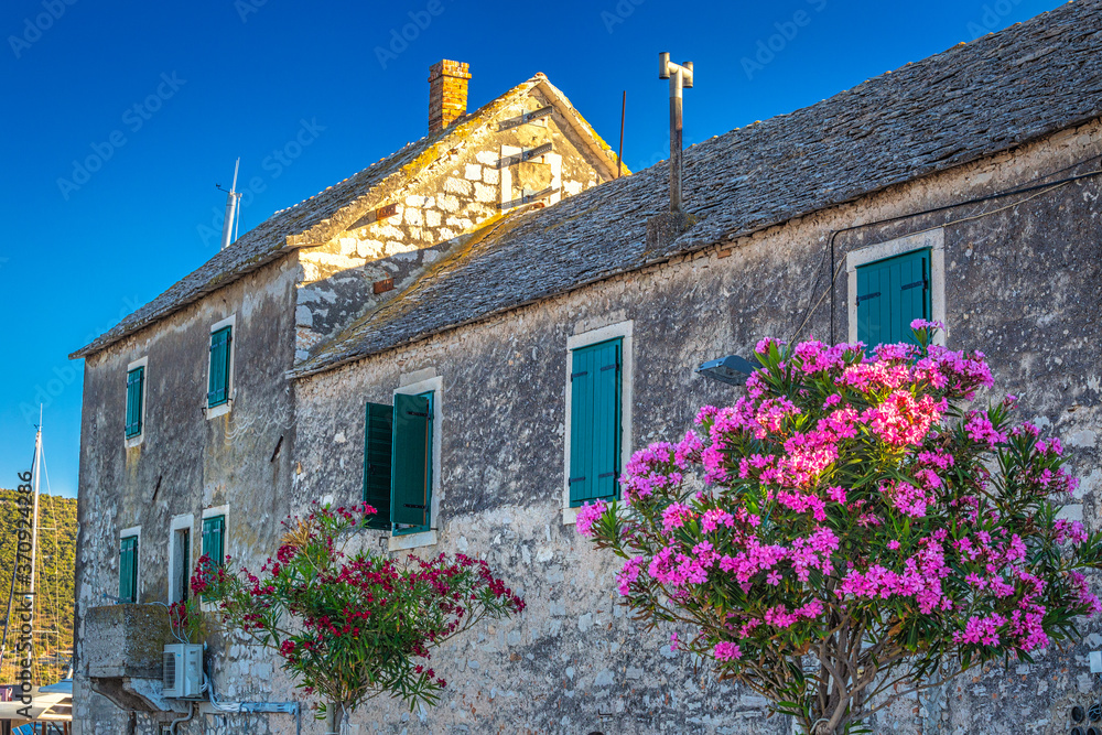 Old stone house in Primosten town, a popular tourist destination on the Dalmatian coast of Adriatic sea in Croatia, Europe.
