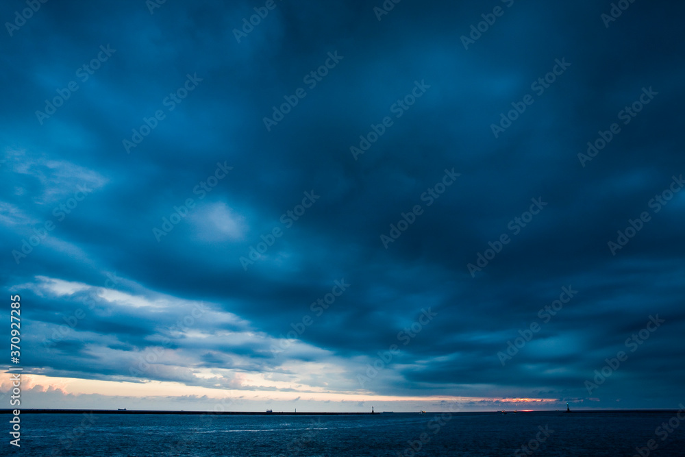 Dramatic sky with stormy clouds above the sea
