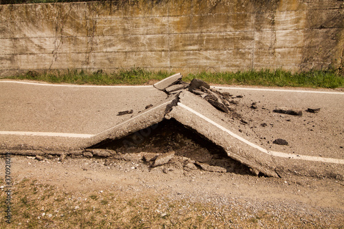 Obraz na plátně close up of broken asphalt divided by a landslide