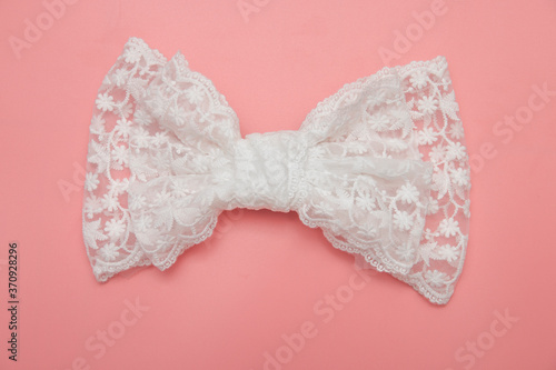 Beautiful hair bow for girls on pink background.