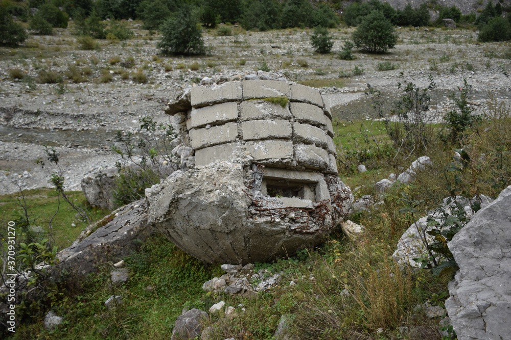 old communist army concrete military bunker broken upside down