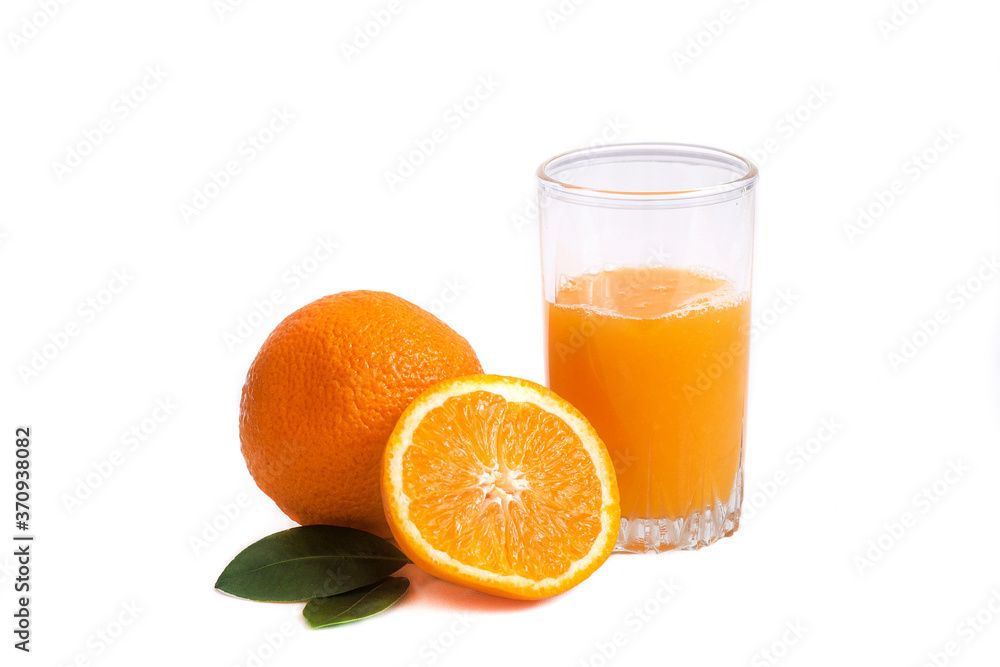 Two apsins and orange juice in a glass on a white background isolate Two apsins and orange juice in a glass on a white background isolate
