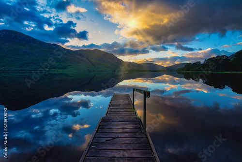 Sunrise with water reflections at Loch Maree, highlands, Scotland.