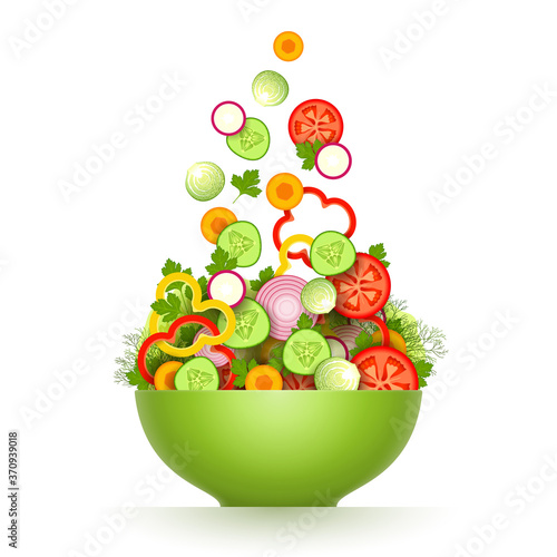 Various sliced fresh vegetables are falling in large green bowl