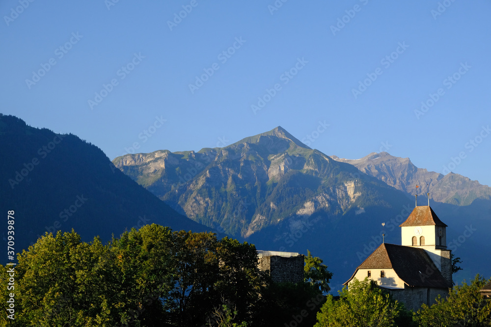 Ringgenberg church and mountains early morning, Berner Oberland, Switzerland