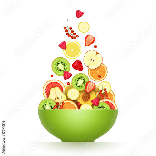 Various ripe fruits and berries are falling in large green bowl