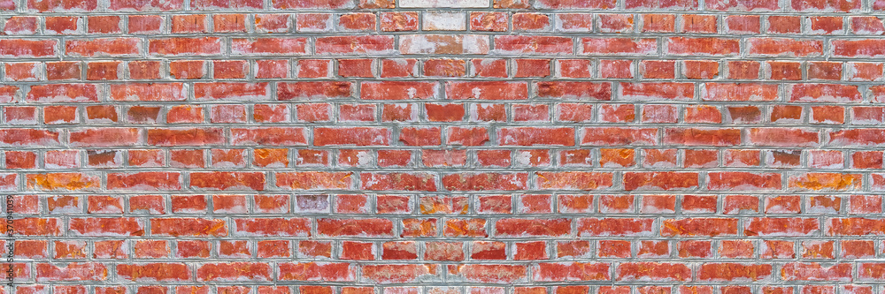 Naklejka premium Panoramic rugged old red brown bricks wall texture. vintage retro industrial banner background.