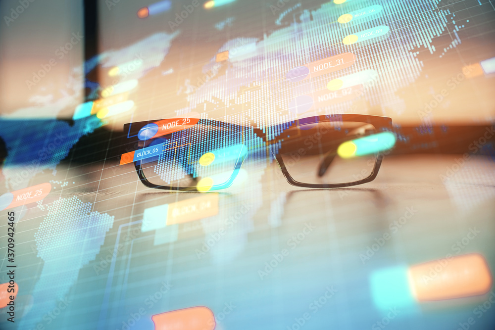 Data tech hologram with glasses on the table background. Concept of technology. Double exposure. Data tech hologram with glasses on the table background. Concept of technology. Double exposure.