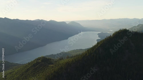 Light rays shine majestically into valley with Keechelus Lake, natural mountains photo