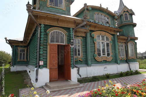 Shorin's wooden house with ornamental carved windows in Gorokhovets town, Vladimir region, Russia. Russian folk and art nouveau style in old vintage architecture. Gorokhovets landmark, monument, sight photo