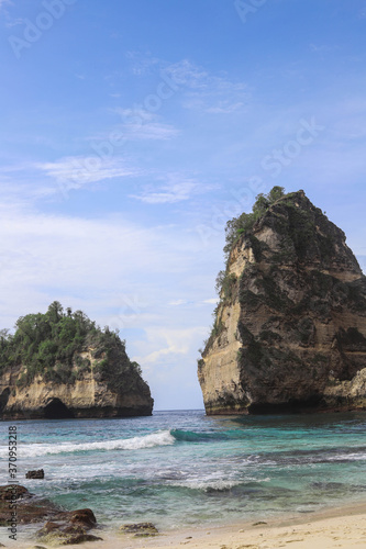 The beautiful Diamond Beach on Nusa Penida Island, Bali, Indonesia. Amazing view, white sand beach with rocky mountains and azure lagoon with clear water of Indian Ocean 