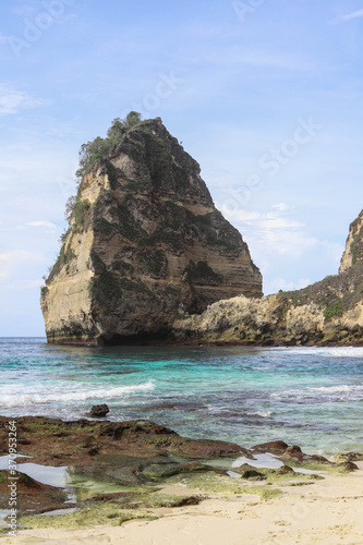 The beautiful Diamond Beach on Nusa Penida Island, Bali, Indonesia. Amazing view, white sand beach with rocky mountains and azure lagoon with clear water of Indian Ocean 