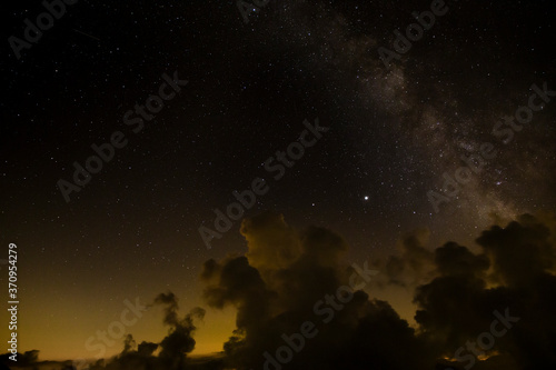 Fototapeta Naklejka Na Ścianę i Meble -  Milky way in the night sky with cloud- long exposure photo on Monte Rosa