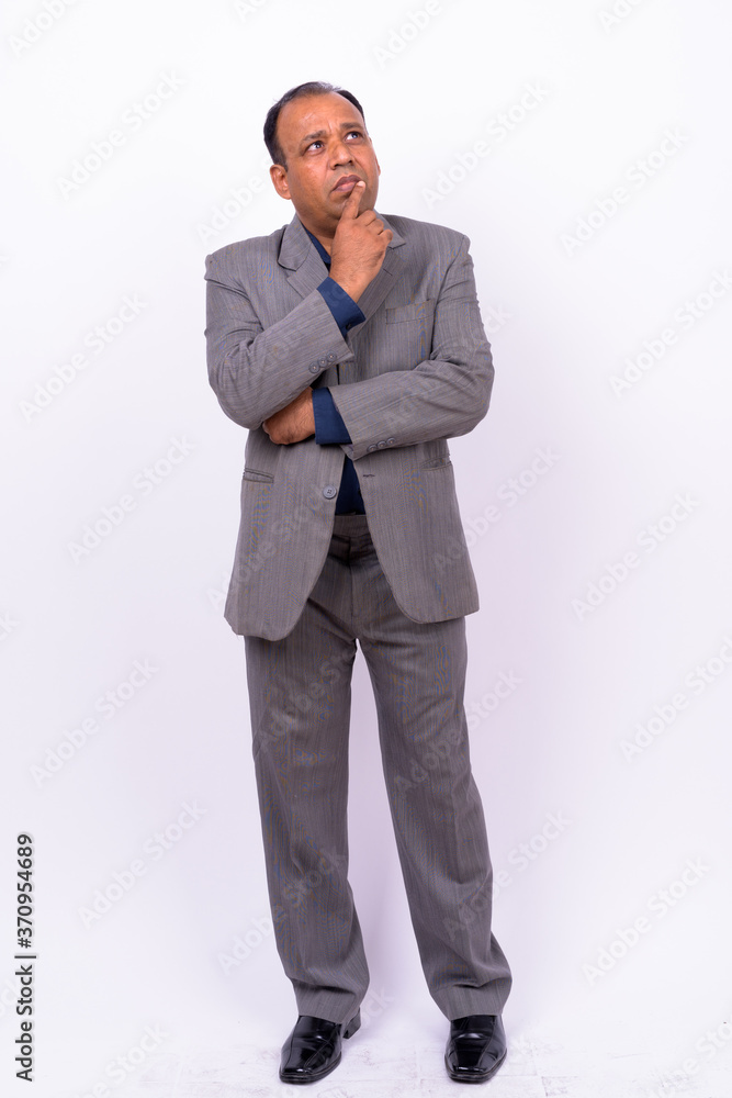 Portrait of mature overweight Indian businessman in suit Portrait of mature overweight Indian businessman in suit