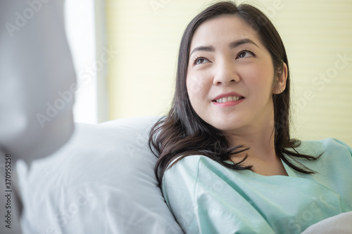 close up woman patient listen carefully to doctor's advice on hospital bed. health care concept.