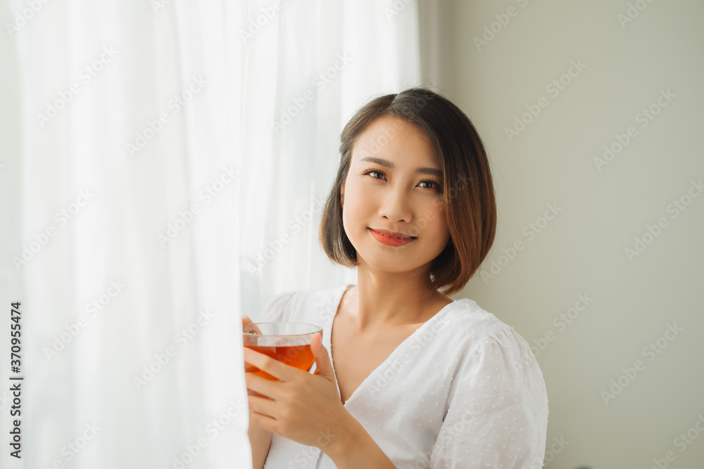 Young asian girl feeling happy with her cup Young asian girl feeling happy with her cup