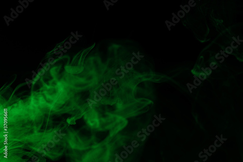 Green steam on a black background.