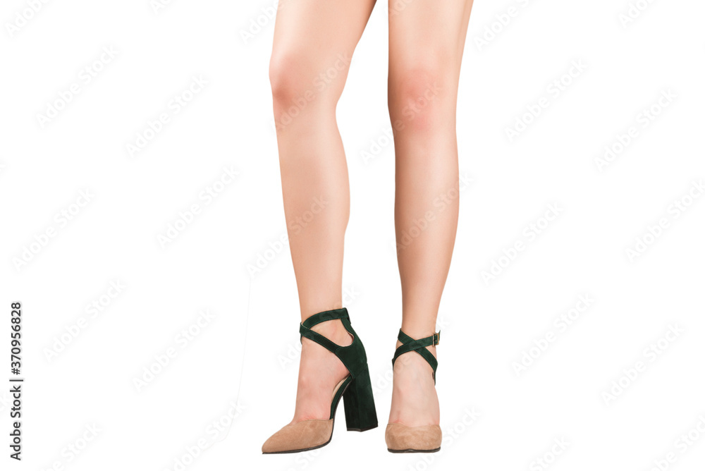 Woman legs in green and beige sandals on heels. Woman legs in green and beige sandals on heels.