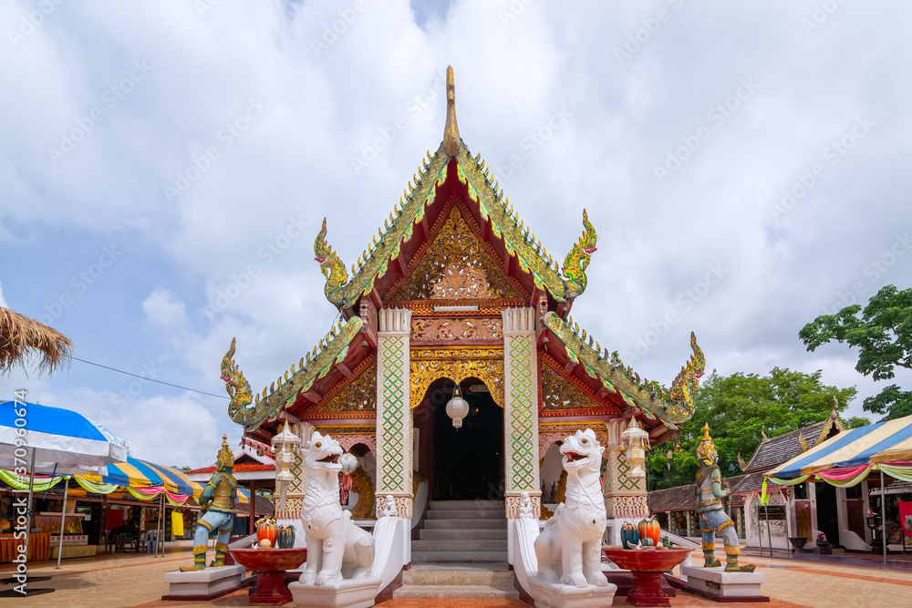 Naklejka premium Big Buddha at Wat Phra That Doi Kham, Chiang Mai, Thailand 