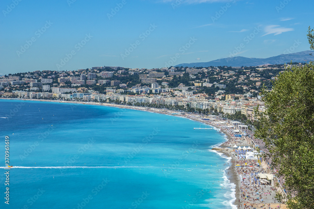 Wonderful panoramic view of Nice with colorful historical houses, seacoast and sea from Cimiez hill. Nice - luxury resort of Cote d'Azur, France.