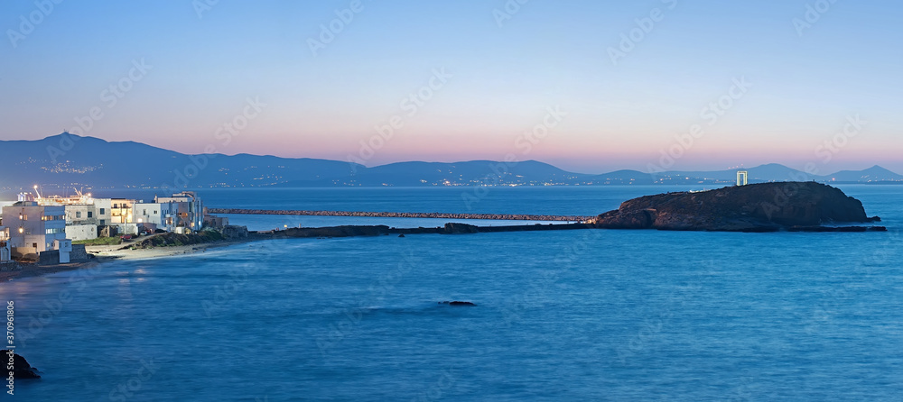 The night panorama of the causeway from Naxos island to islet of Palatia with The Portara (the Great Door) in Greece The night panorama of the causeway from Naxos island to islet of Palatia with The Portara (the Great Door) in Greece