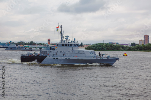 Russian warships in Volga river in Astrakhan in summer at cloudy day. Russian Military vessels.
