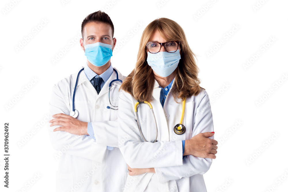 Studio shot of medical team standing at isolated white background Studio shot of medical team standing at isolated white background
