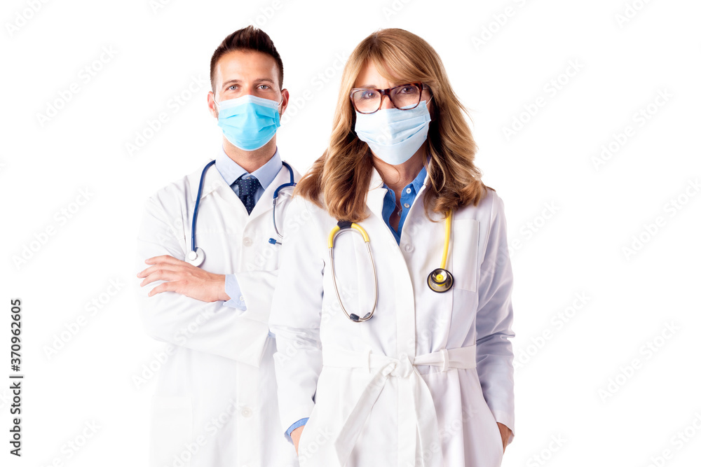 Studio shot of medical team standing at isolated white background Studio shot of medical team standing at isolated white background