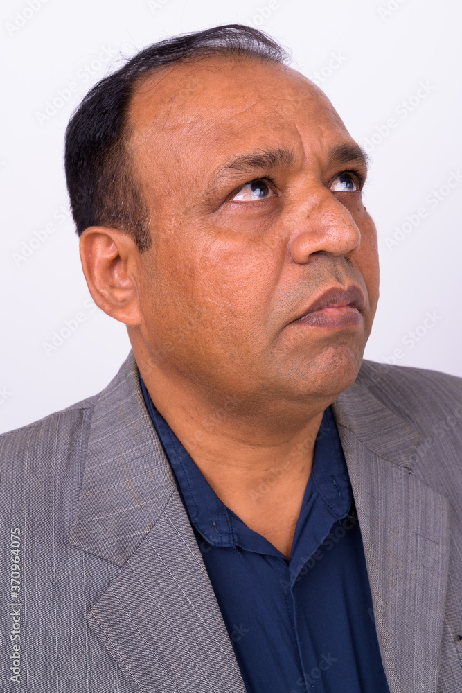 Portrait of mature overweight Indian businessman in suit Portrait of mature overweight Indian businessman in suit