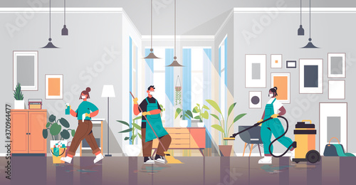 mix race cleaners in masks disinfecting coronavirus cells to prevent covid-19 pandemic cleaning service disinfection concept living room interior horizontal full length vector illustration