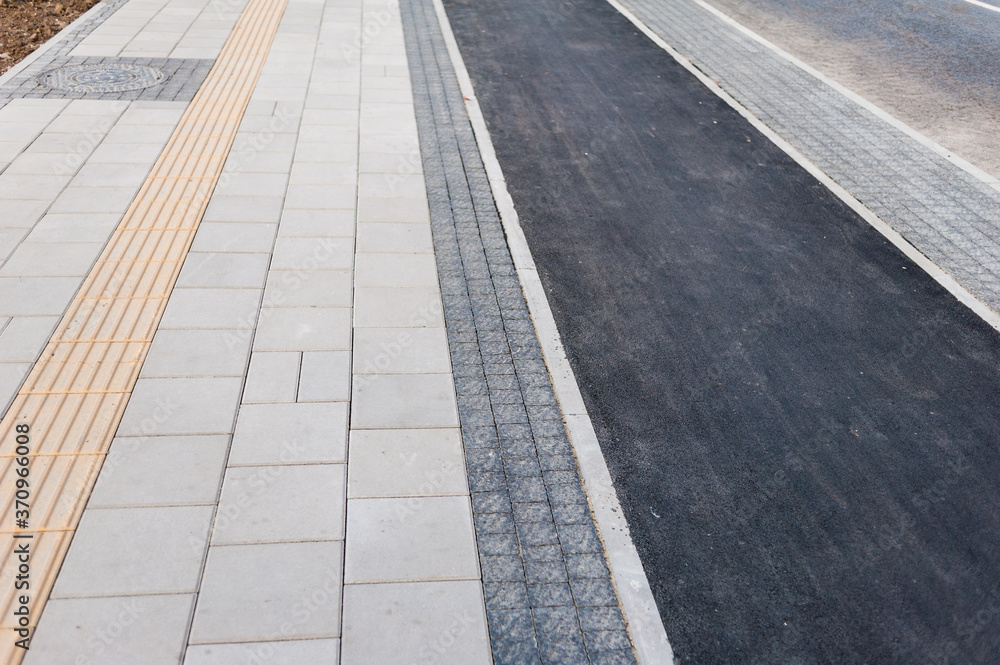 Fototapeta premium Road for bicycles, cars and trams