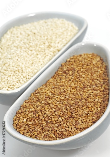 Natural Sesame and Gold Coloured Sesam, sesamum indicum, Seeds against White Background